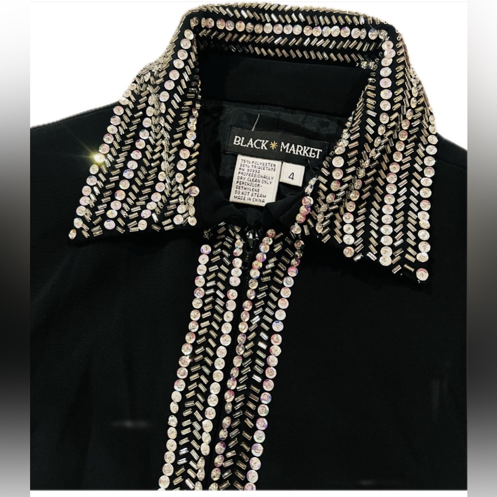 Brand: Black Market size 4 black vintage blazer with silver sequence.